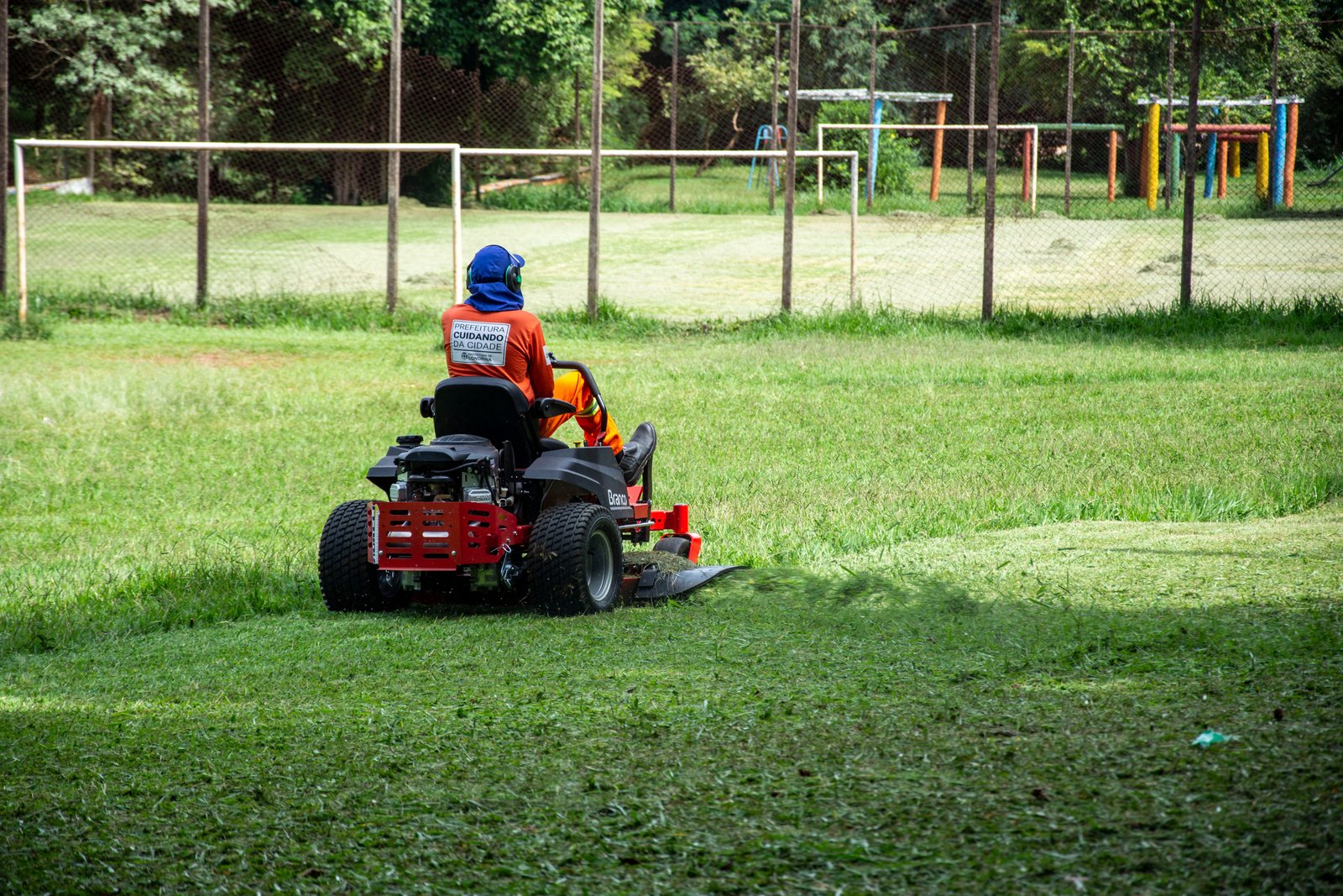 Technician cleaning artificial turf